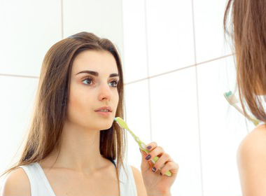 Woman wondering if oral health can affect acne